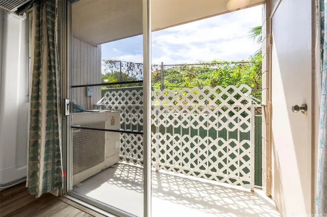 a kitchen with a refrigerator and a large window