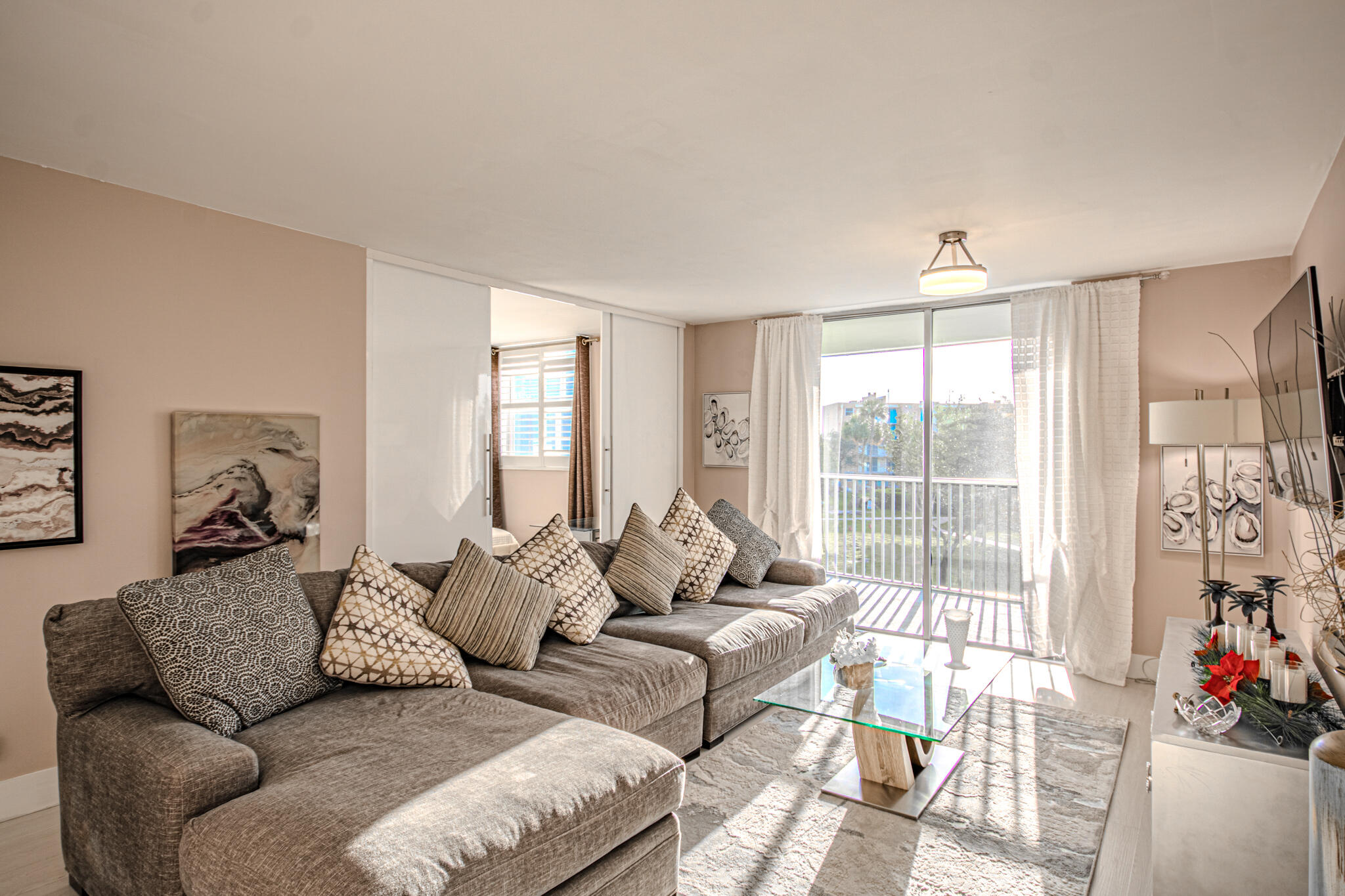 a living room with furniture and a large window