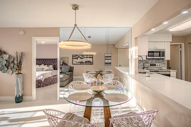 a kitchen with stainless steel appliances a refrigerator and a stove top oven