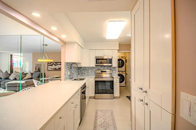 a bedroom with a large bed and a couch