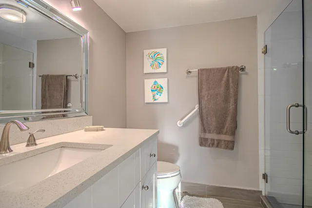 a room with a refrigerator and a sink