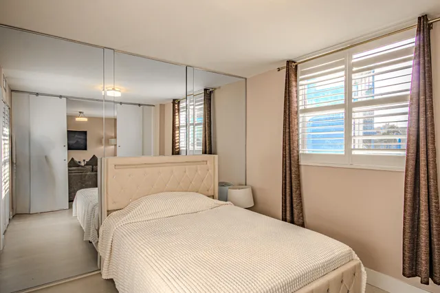 a bathroom with a sink a toilet and a window