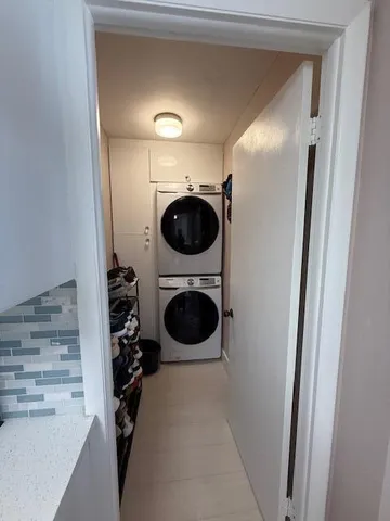 a view of a porch with a table and chairs