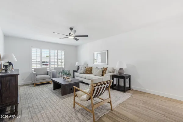 a living room with furniture and a large window