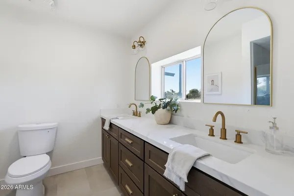 an empty room with a ceiling fan and carpet