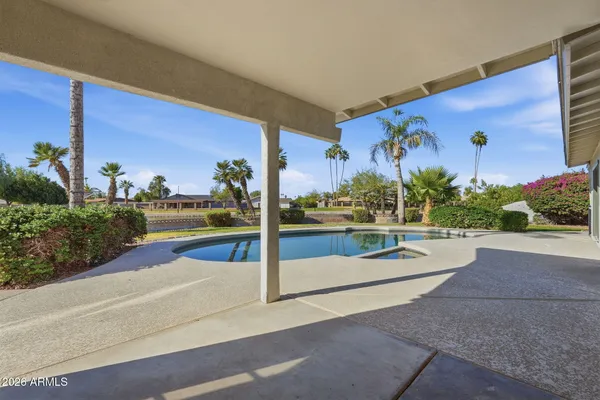 a view of a house with outdoor space and a lake view
