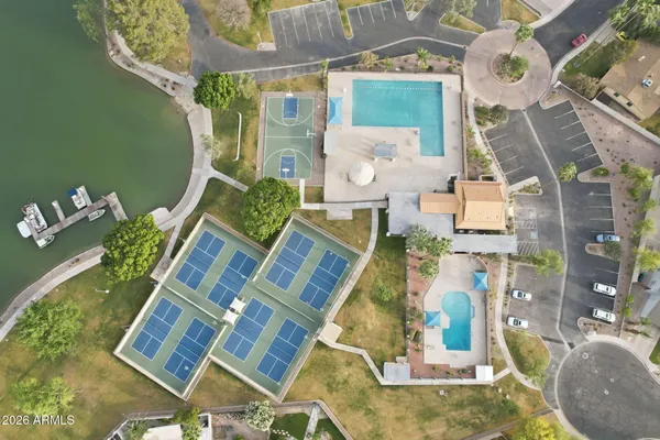 an aerial view of a house with outdoor space pool seating area and fire pit