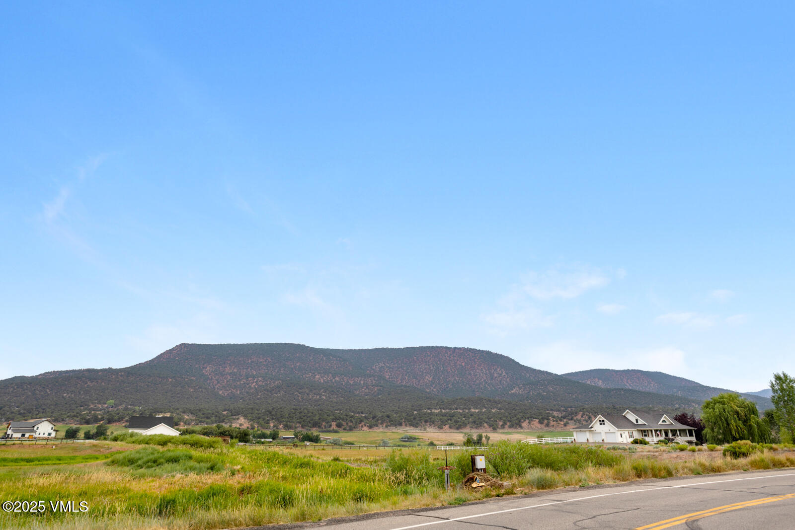 780 Grundel Way Gypsum, CO 81637 - Photo 19 of 19 a view of a lush green hillside and houses