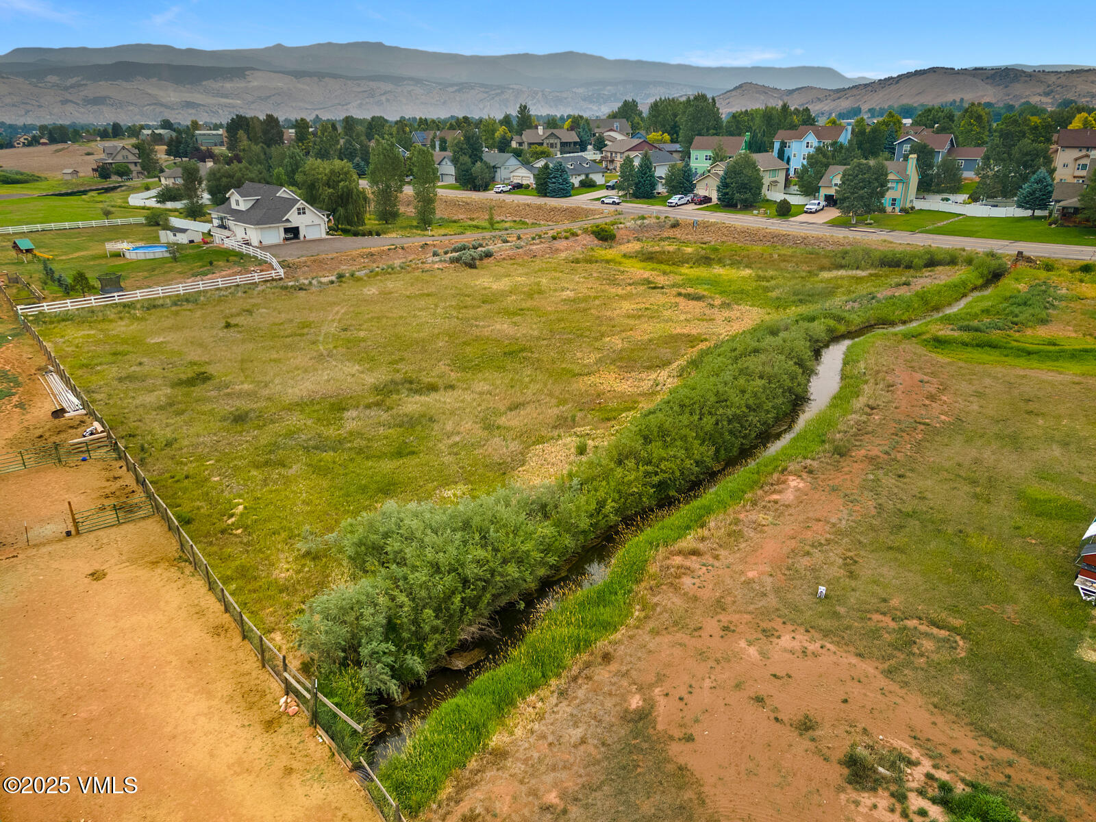 780 Grundel Way Gypsum, CO 81637 - Photo 10 of 19 a view of an swimming pool with a yard and mountain view