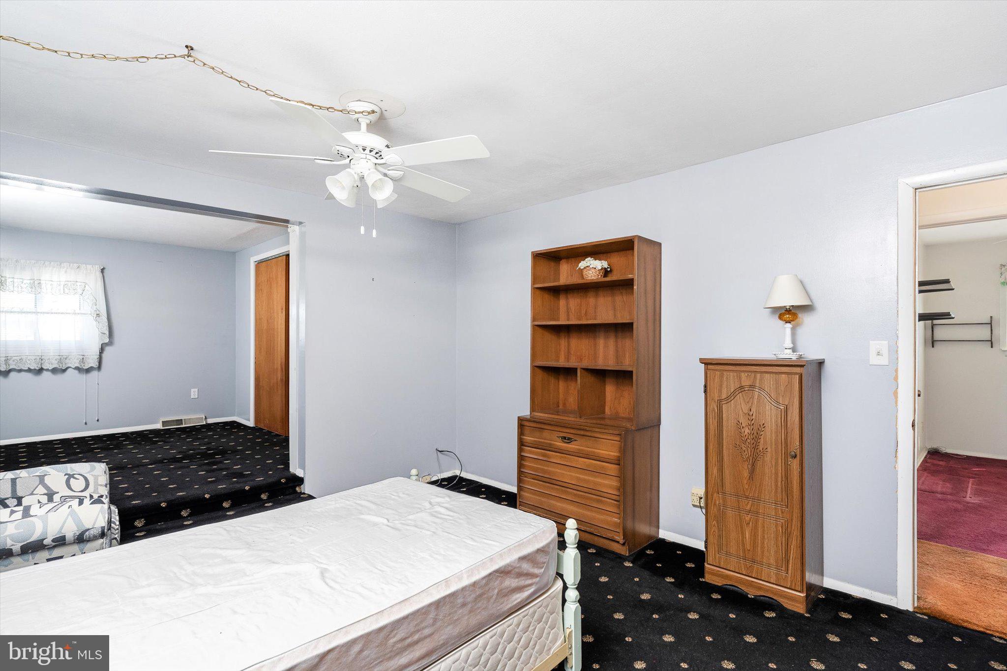 16 Fenway Road Hamilton, NJ 08620 - Photo 17 of 32 a bedroom with a dresser and a chandelier