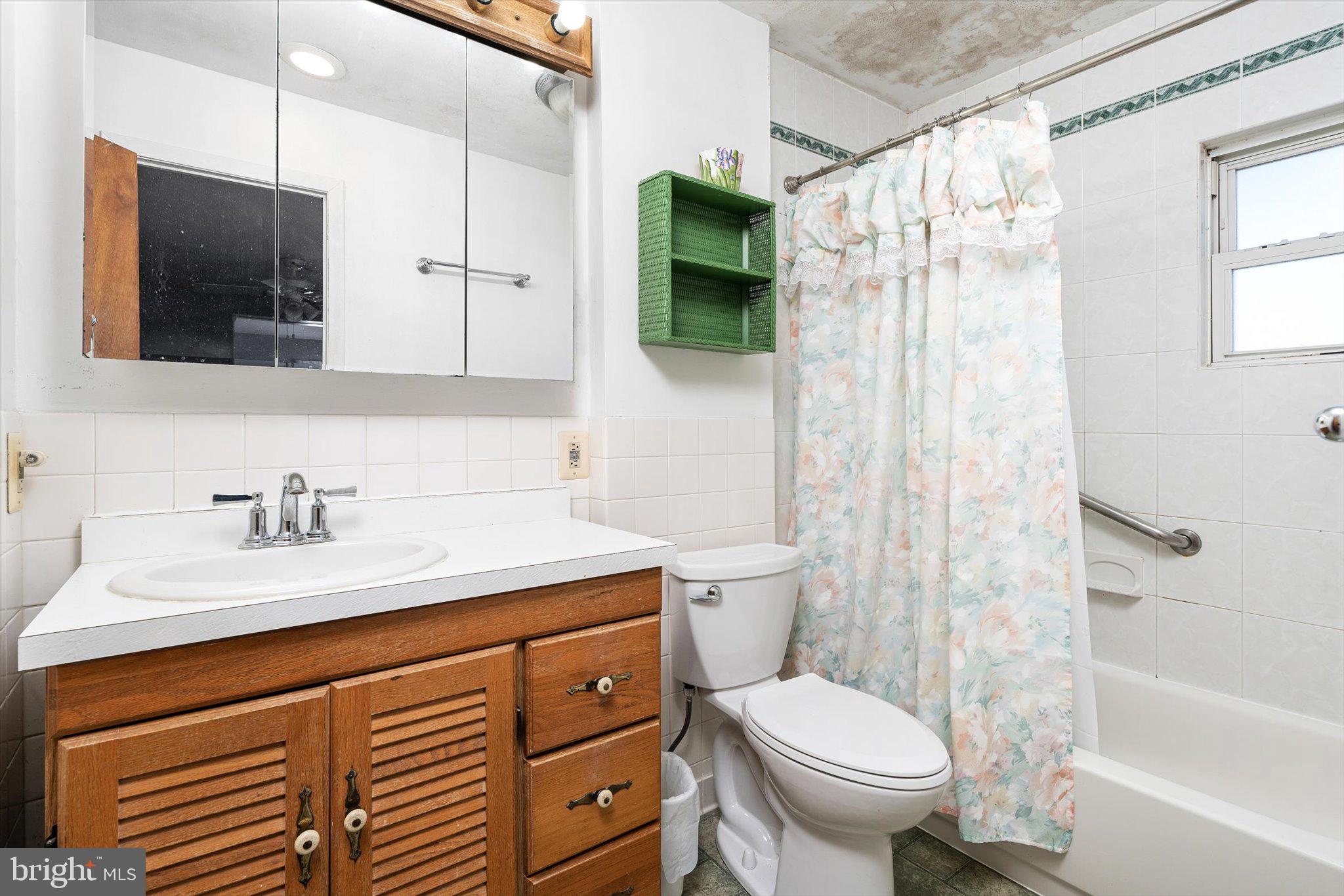 16 Fenway Road Hamilton, NJ 08620 - Photo 20 of 32 a bathroom with a sink toilet and shower