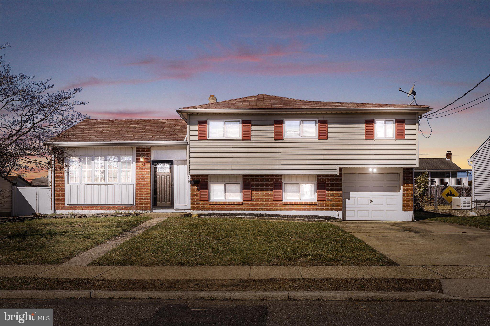 16 Fenway Road Hamilton, NJ 08620 - Photo 2 of 32 a front view of a house with a yard