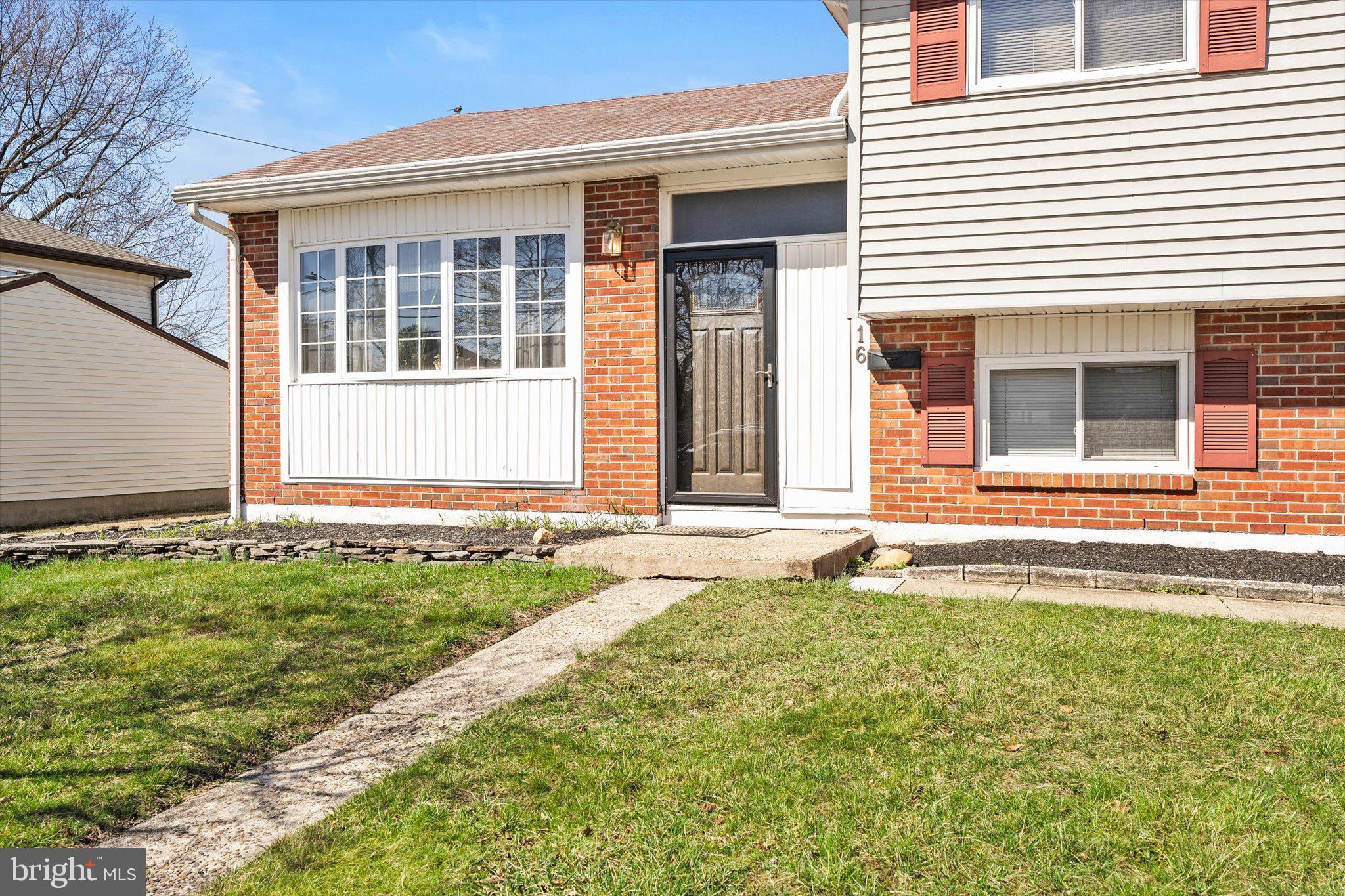 16 Fenway Road Hamilton, NJ 08620 - Photo 3 of 32 a front view of a house with a yard
