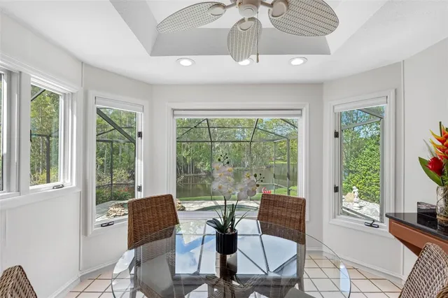 a view of a dining room with furniture window and outside view