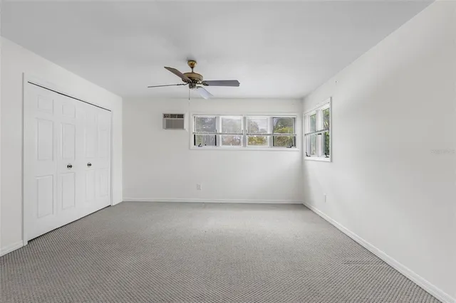 a view of empty room with windows