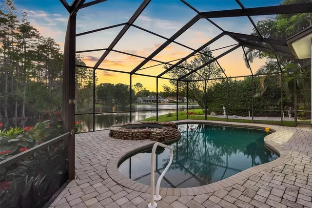a view of a swimming pool with a patio