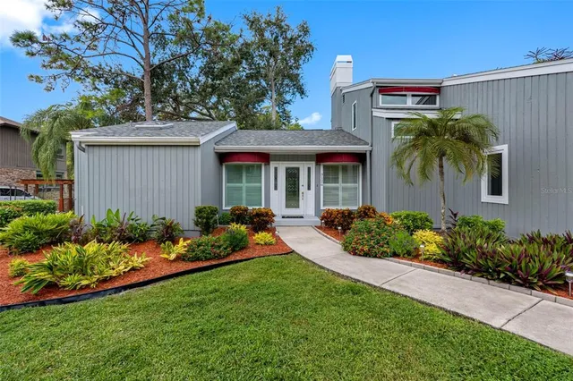 a house view with a seating space and a potted plant