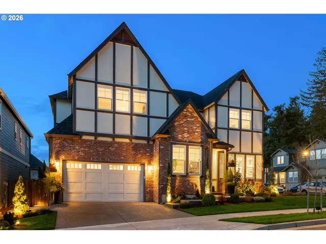 a front view of a residential apartment building with a yard