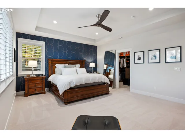 a bedroom with furniture and a flat screen tv