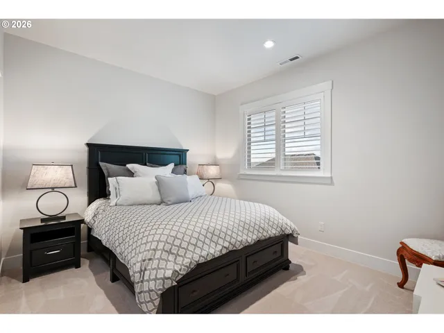 a bedroom with a bed and a tv