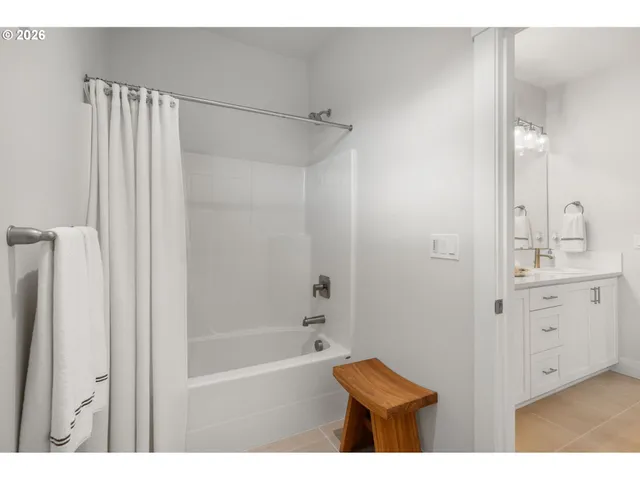 a bedroom with a bed and a lamp