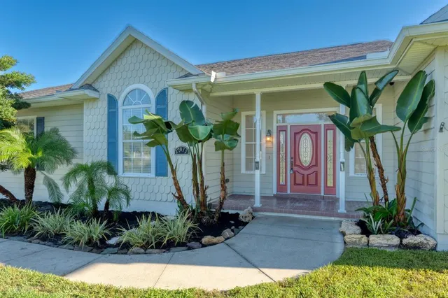 a front view of a house with garden