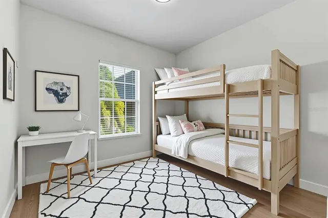 a bedroom with a bed and a couch