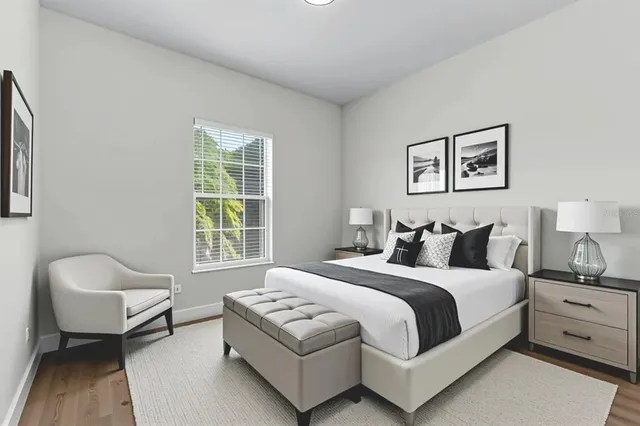 a bedroom with a bed and a couch