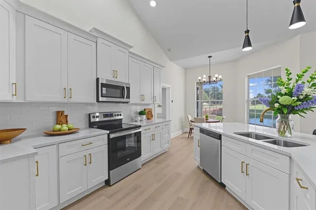 a dining room with furniture a rug and wooden floor