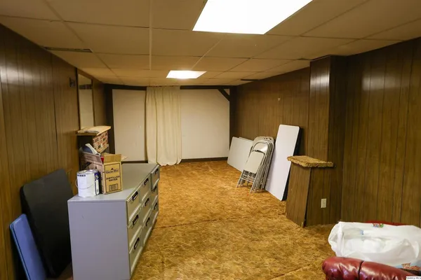 a bed room with a bed and a chair