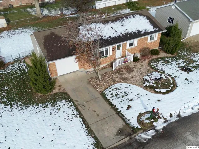 a view of a backyard of the house