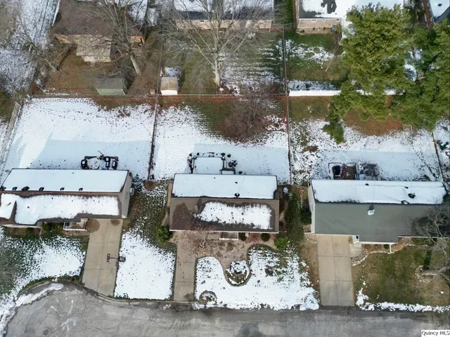 an aerial view of a house with outdoor space