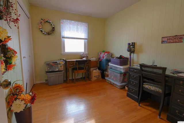 a bedroom with a workspace