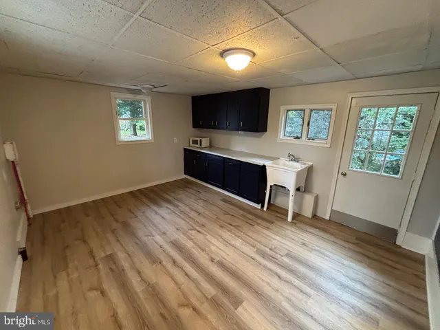 a view of a livingroom with furniture and a flat screen tv
