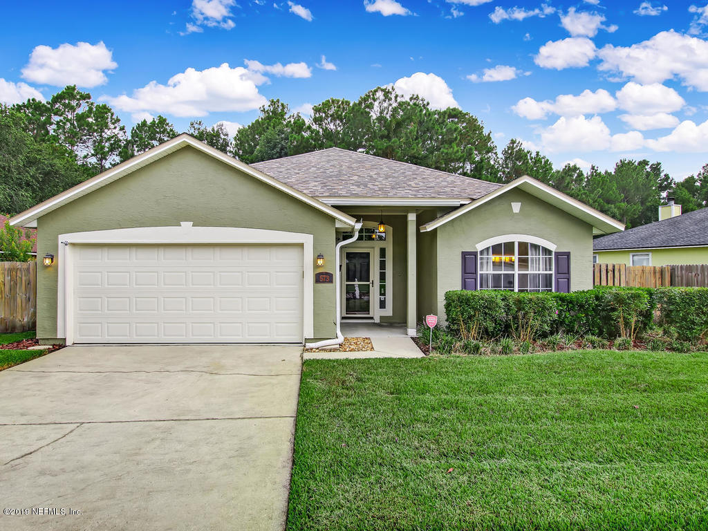 573 Prosperity Lake Drive St. Augustine, FL 32092 - Photo 1 of 23 a front view of house with yard and green space