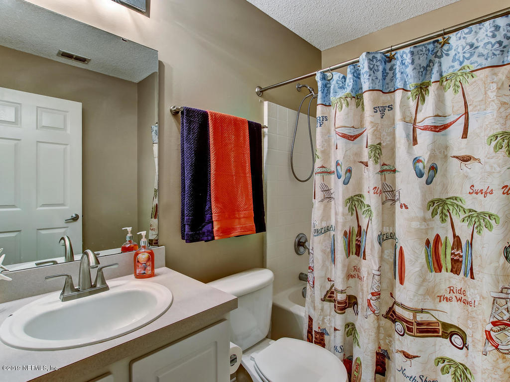 573 Prosperity Lake Drive St. Augustine, FL 32092 - Photo 15 of 23 a bathroom with a sink toilet and shower