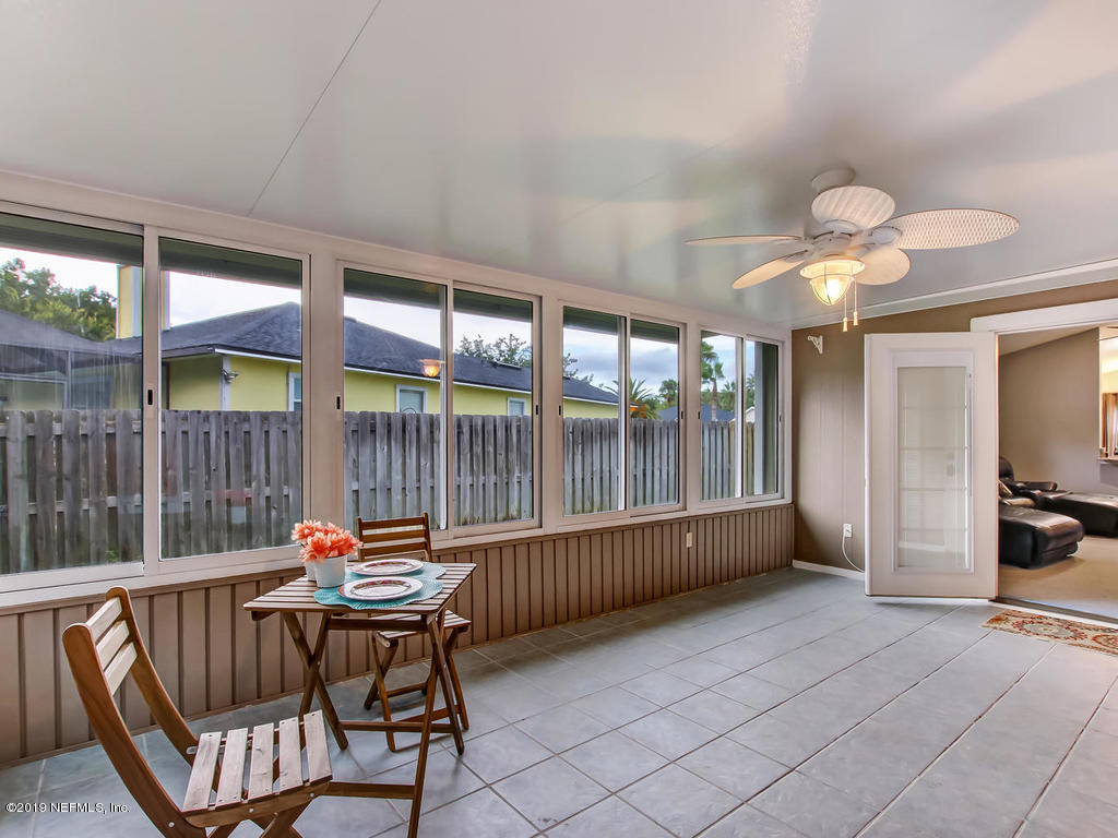 573 Prosperity Lake Drive St. Augustine, FL 32092 - Photo 18 of 23 a living room with furniture and a large window