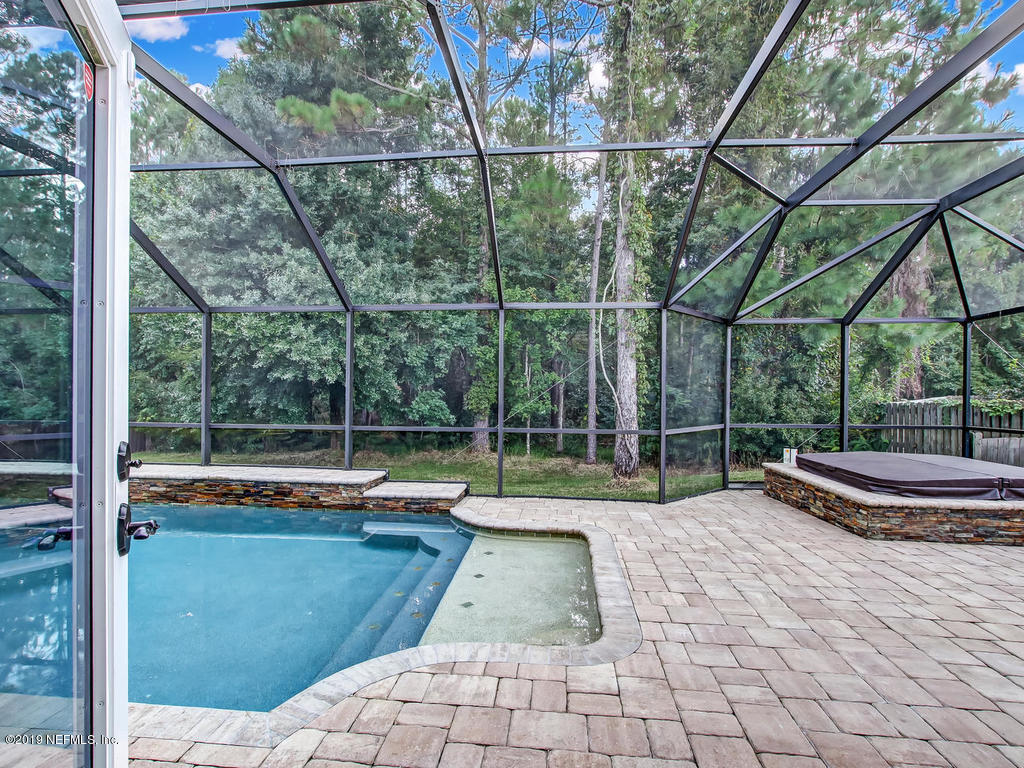 573 Prosperity Lake Drive St. Augustine, FL 32092 - Photo 19 of 23 a view of a backyard with sitting area