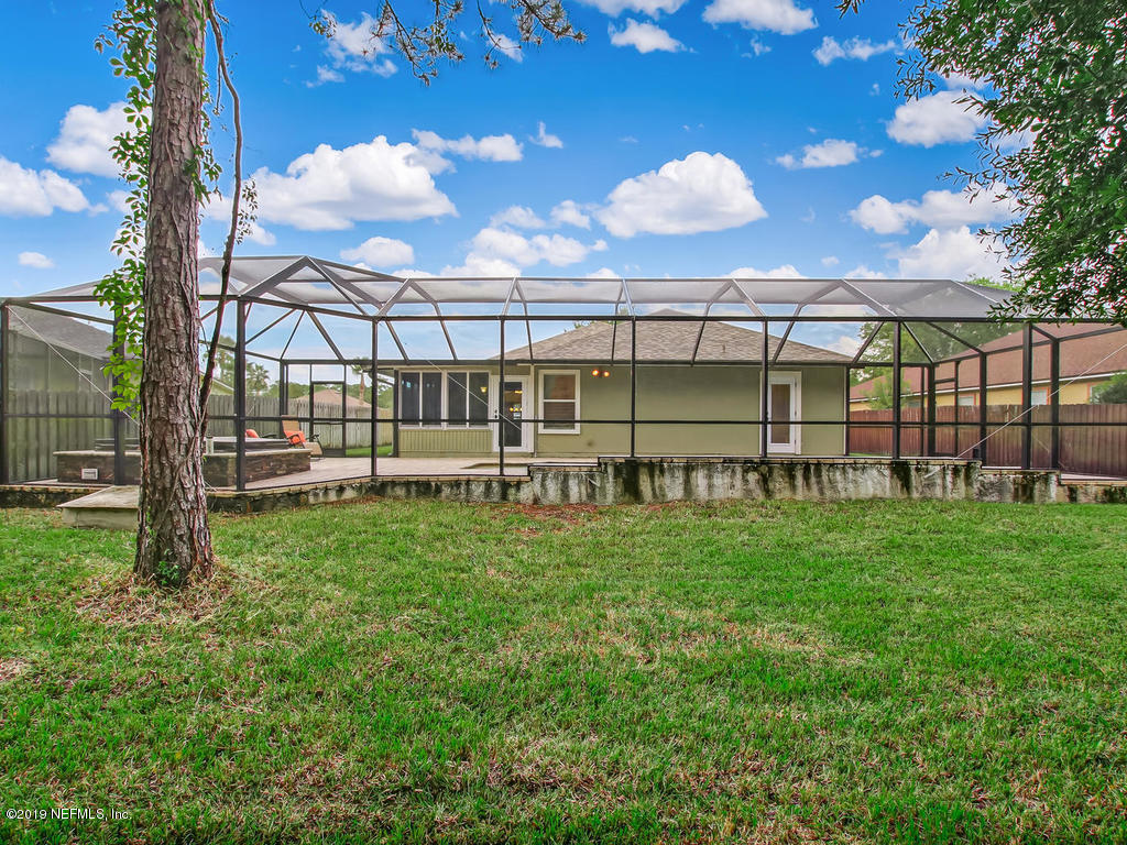573 Prosperity Lake Drive St. Augustine, FL 32092 - Photo 22 of 23 a view of a yard with a house