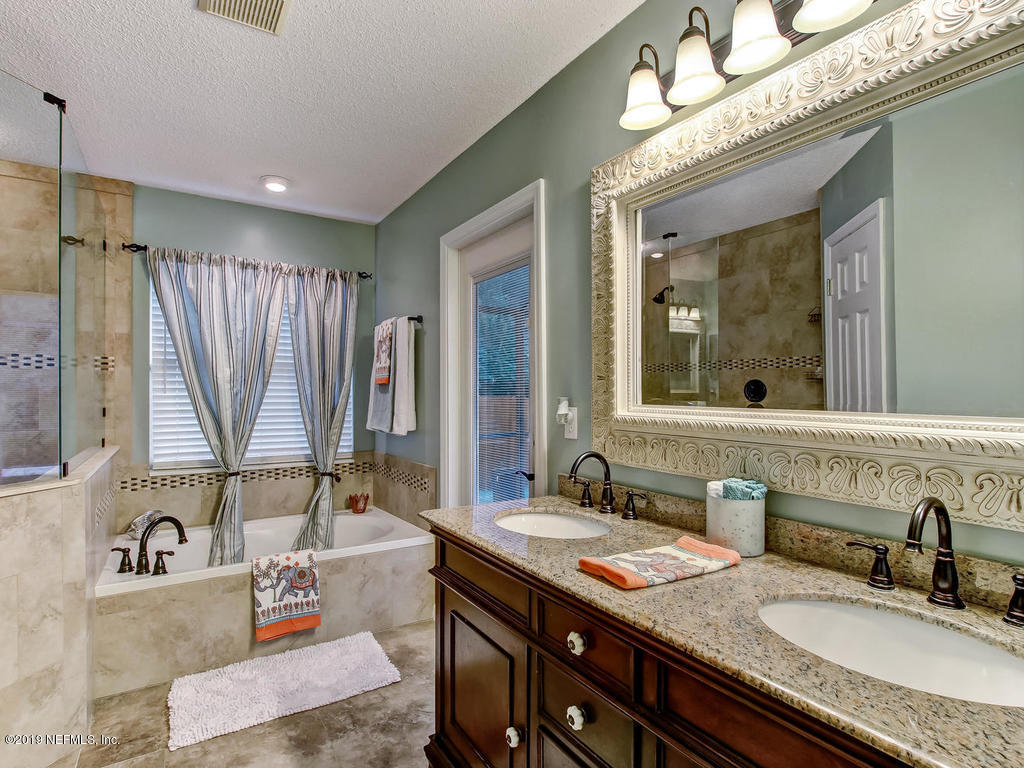 573 Prosperity Lake Drive St. Augustine, FL 32092 - Photo 10 of 23 a bathroom with double vanity sink and a mirror