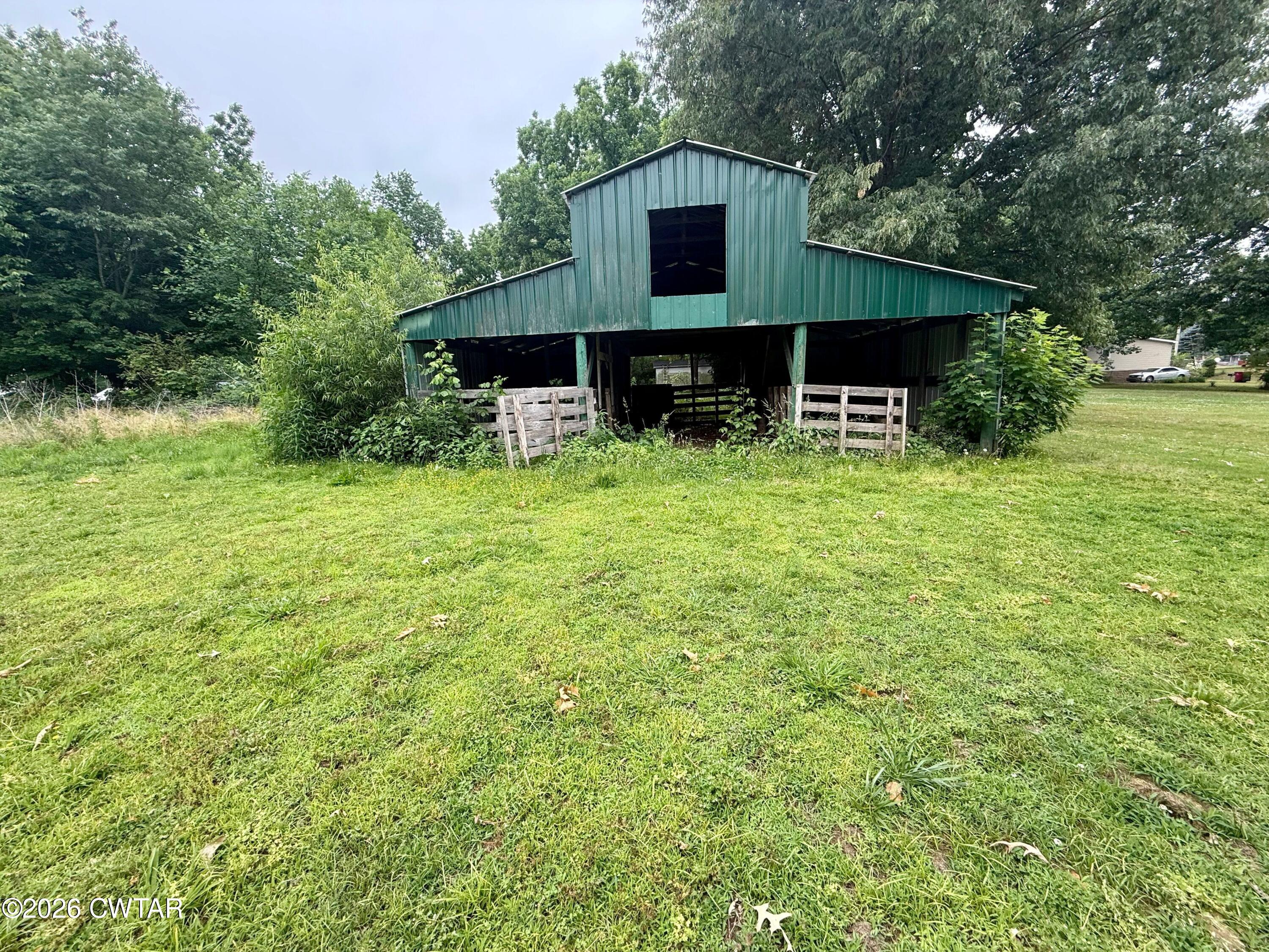 1935 Buster Collins Road Kenton, TN 38233 - Photo 17 of 18 a house view with a garden space