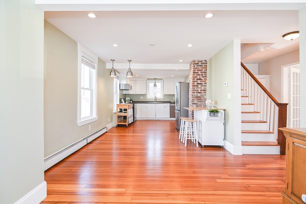 58 Holmes Road Dedham, MA 02026 - Photo 11 of 29 a view of kitchen with furniture and wooden floor