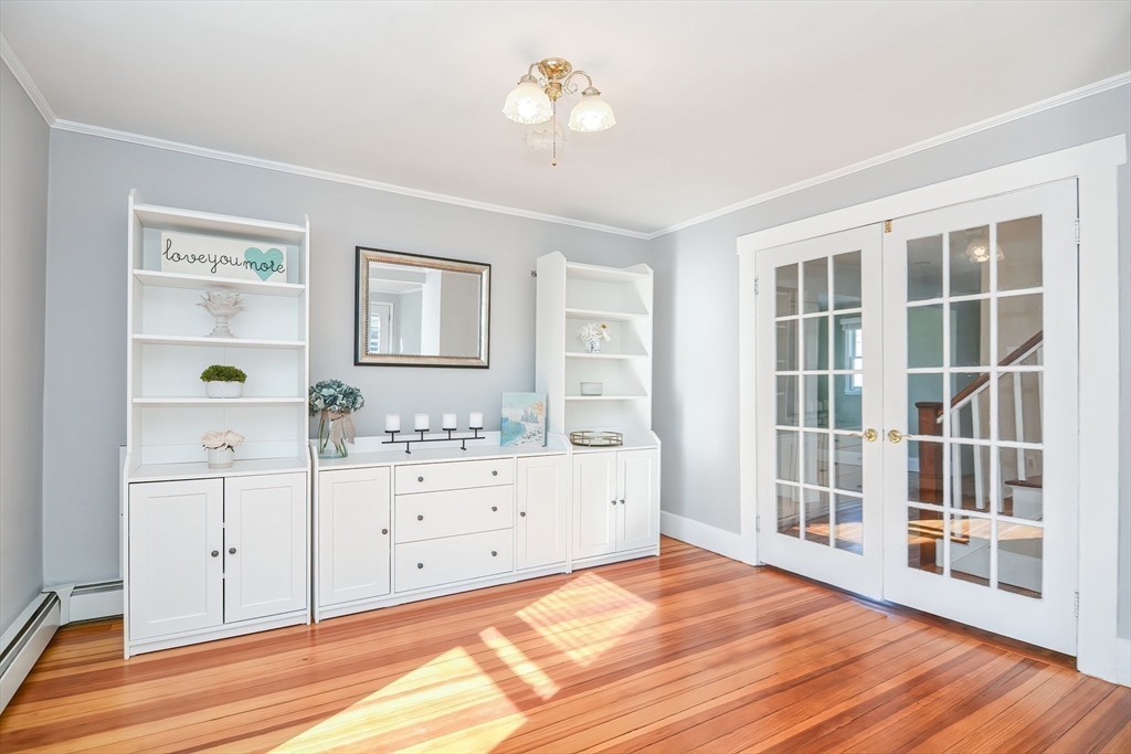 58 Holmes Road Dedham, MA 02026 - Photo 13 of 29 a view of a bedroom with cabinet and windows