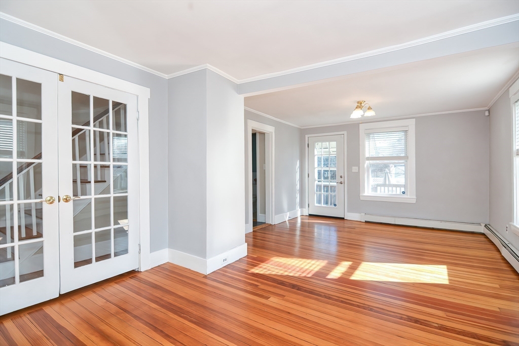58 Holmes Road Dedham, MA 02026 - Photo 14 of 29 a view of empty room with wooden floor and fan