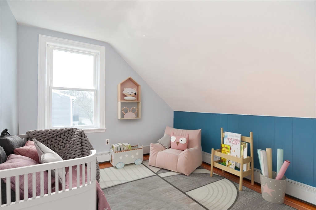 58 Holmes Road Dedham, MA 02026 - Photo 19 of 29 a bedroom with furniture and a window