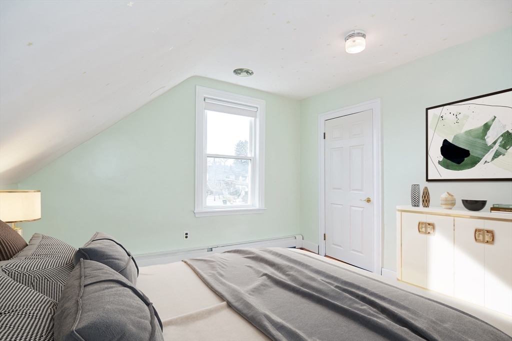 58 Holmes Road Dedham, MA 02026 - Photo 22 of 29 a bedroom with a bed and a window