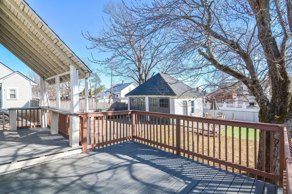 58 Holmes Road Dedham, MA 02026 - Photo 25 of 29 a porch with wooden floor and fence