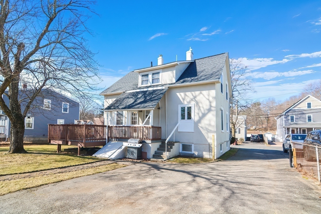 58 Holmes Road Dedham, MA 02026 - Photo 26 of 29 a view of a playground with a patio