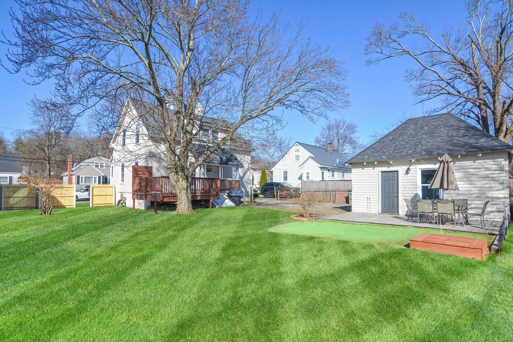 58 Holmes Road Dedham, MA 02026 - Photo 28 of 29 a house view with a sitting space and garden