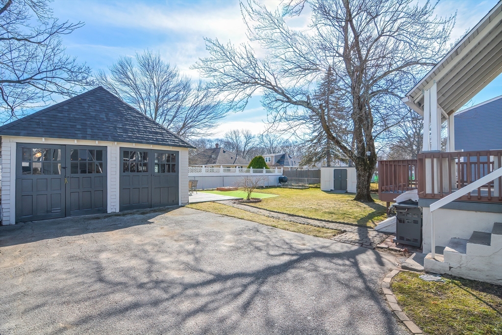 58 Holmes Road Dedham, MA 02026 - Photo 3 of 29 a view of a house with backyard and sitting area